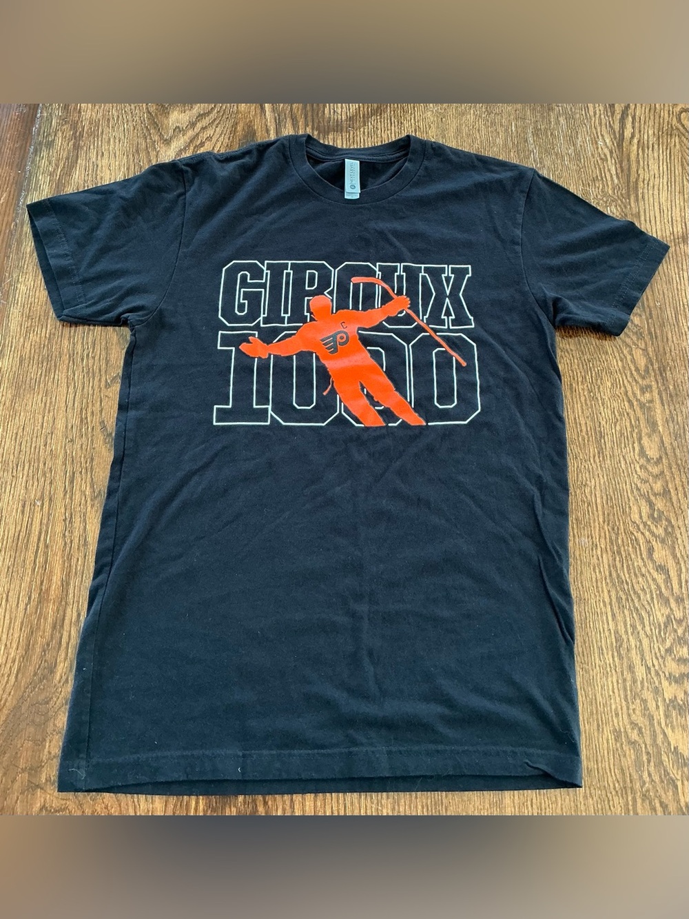 Next Level Apparel Black Kids T-Shirt with Orange Graphic